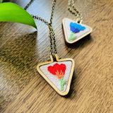 red and orange embroidered wood triangle necklace