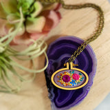 bold gem colored embroidered floral pendant
