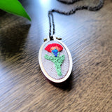 multicolored embroidered flower oval pendant