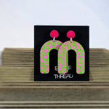 patterned green and pink arch earrings