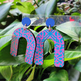 pink and blue patterned arch earrings